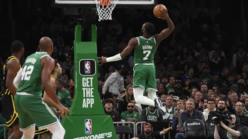 Mar 3, 2024; Boston, Massachusetts, USA; Boston Celtics guard Jaylen Brown (7) goes in for a dunk during the second half against the Golden State Warriors at TD Garden. Mandatory Credit: Bob DeChiara-USA TODAY Sports