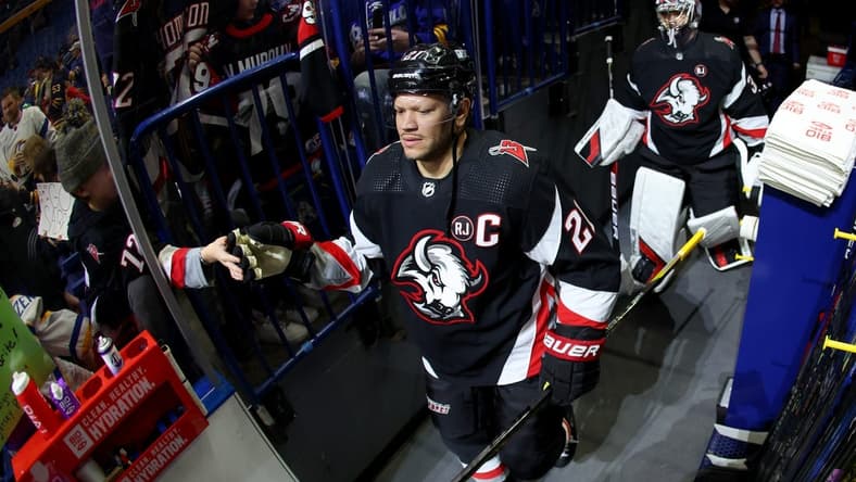 Mar 3, 2024; Buffalo, New York, USA; Buffalo Sabres right wing Kyle Okposo (21) makes his way to the ice before a game against the Winnipeg Jets at KeyBank Center. Mandatory Credit: Timothy T. Ludwig-USA TODAY Sports