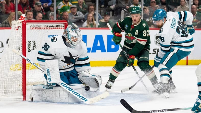Mar 3, 2024; Saint Paul, Minnesota, USA; San Jose Sharks goaltender Kaapo Kahkonen (36) makes a save as Minnesota Wild left wing Kirill Kaprizov (97) awaits a rebound in the second period at Xcel Energy Center. Mandatory Credit: Matt Blewett-USA TODAY Sports