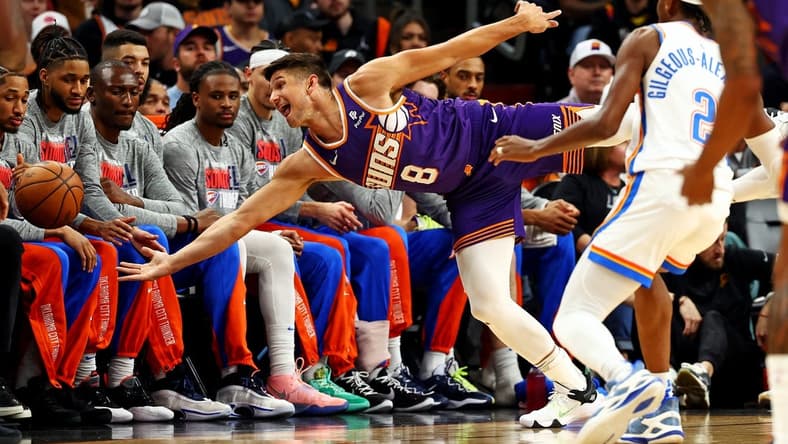 Mar 3, 2024; Phoenix, Arizona, USA; Phoenix Suns guard Grayson Allen (8) tries to save the ball from going out of bounds against Oklahoma City Thunder guard Shai Gilgeous-Alexander (2) during the first quarter at Footprint Center. Mandatory Credit: Mark J. Rebilas-USA TODAY Sports