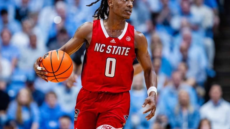 Mar 2, 2024; Chapel Hill, North Carolina, USA; North Carolina State Wolfpack guard DJ Horne (0) brings the ball up court against the North Carolina Tar Heels at Dean E. Smith Center. Mandatory Credit: Scott Kinser-USA TODAY Sports
