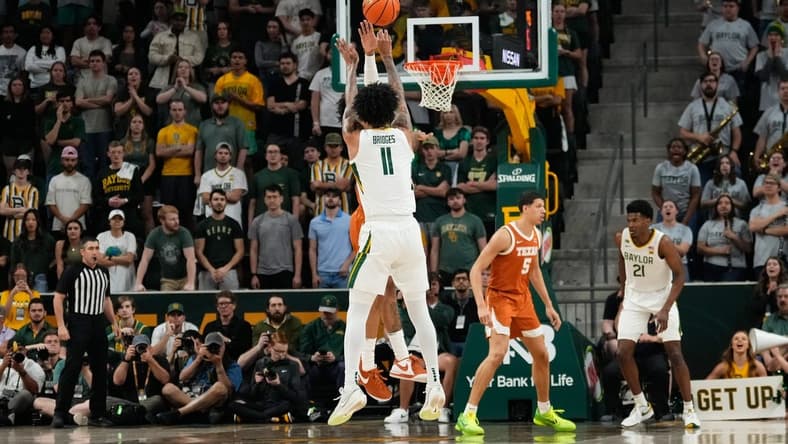 Mar 4, 2024; Waco, Texas, USA; Baylor Bears forward Jalen Bridges (11) scores a three point basket against the Texas Longhorns during the first half at Paul and Alejandra Foster Pavilion. Mandatory Credit: Chris Jones-USA TODAY Sports