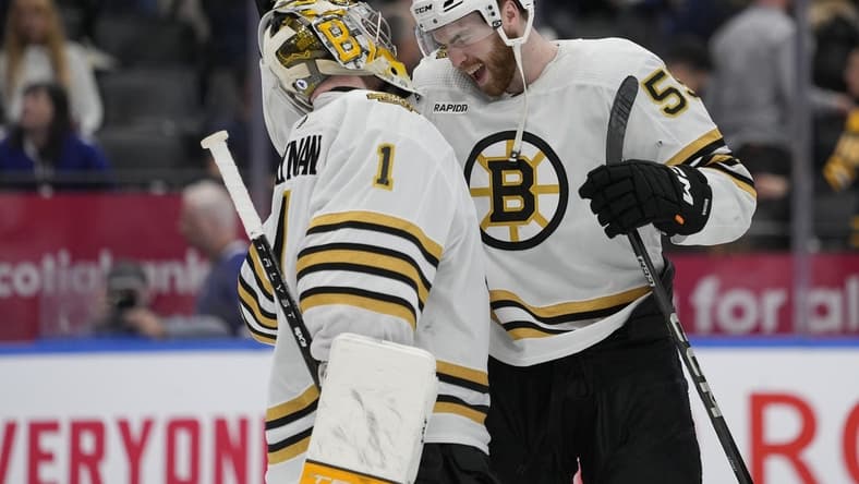 Mar 4, 2024; Toronto, Ontario, CAN; Boston Bruins goaltender Jeremy Swayman (1) and forward Justin Brazeau (55) celebrate a win over the Toronto Maple Leafs at Scotiabank Arena. Mandatory Credit: John E. Sokolowski-USA TODAY Sports