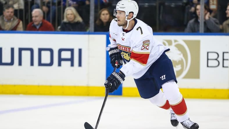 Mar 4, 2024; New York, New York, USA;  Florida Panthers defenseman Dmitry Kulikov (7) controls the puck in the first period against the New York Rangers at Madison Square Garden. Mandatory Credit: Wendell Cruz-USA TODAY Sports