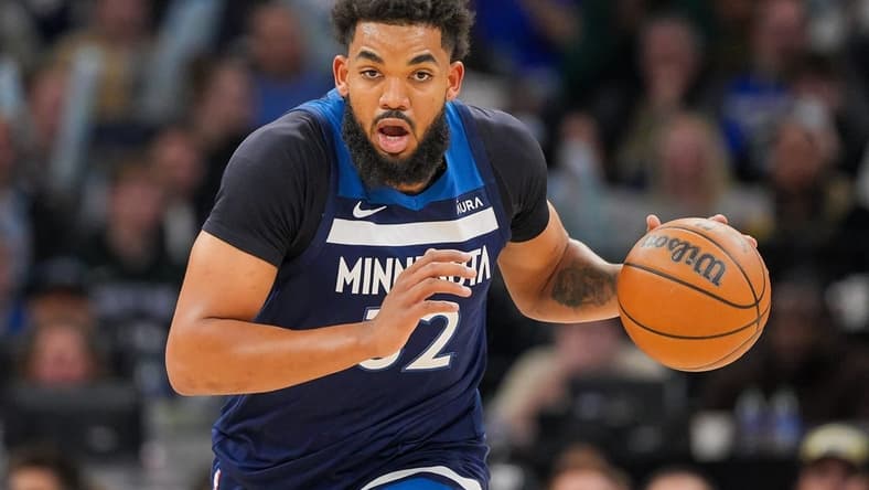 Mar 4, 2024; Minneapolis, Minnesota, USA; Minnesota Timberwolves center Karl-Anthony Towns (32) dribbles against the Portland Trail Blazers in the third quarter at Target Center. Mandatory Credit: Brad Rempel-USA TODAY Sports