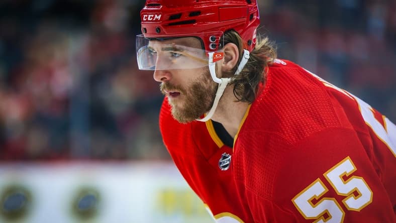 Mar 4, 2024; Calgary, Alberta, CAN; Calgary Flames defenseman Noah Hanifin (55) against the Seattle Kraken during the second period at Scotiabank Saddledome. Mandatory Credit: Sergei Belski-USA TODAY Sports