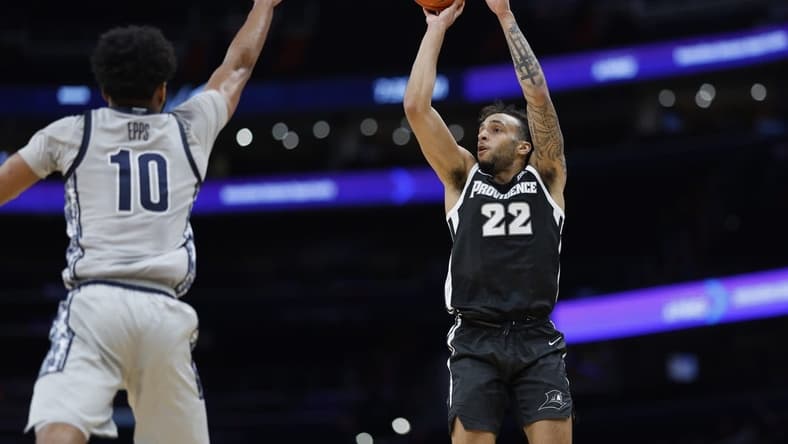 Mar 5, 2024; Washington, District of Columbia, USA;Providence Friars guard Devin Carter (22) shoots the ball as Georgetown Hoyas guard Jayden Epps (10) defends in the first half at Capital One Arena. Mandatory Credit: Geoff Burke-USA TODAY Sports