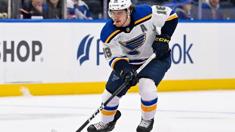 Mar 5, 2024; Elmont, New York, USA; St. Louis Blues center Robert Thomas (18) skates with puck against the New York Islanders during the first period at UBS Arena. Mandatory Credit: Dennis Schneidler-USA TODAY Sports
