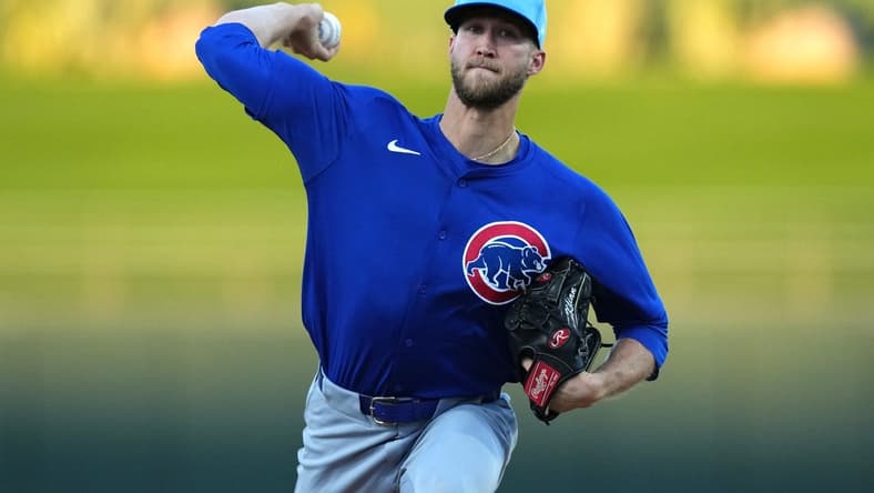 Mar 5, 2024; Surprise, Arizona, USA; Chicago Cubs starting pitcher Caleb Kilian (45) pitches against the Kansas City Royals during the first inning at Surprise Stadium. Mandatory Credit: Joe Camporeale-USA TODAY Sports