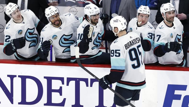 Mar 5, 2024; Winnipeg, Manitoba, CAN; Seattle Kraken left wing Andre Burakovsky (95) celebrates his third period goal against the Winnipeg Jets at Canada Life Centre. Mandatory Credit: James Carey Lauder-USA TODAY Sports