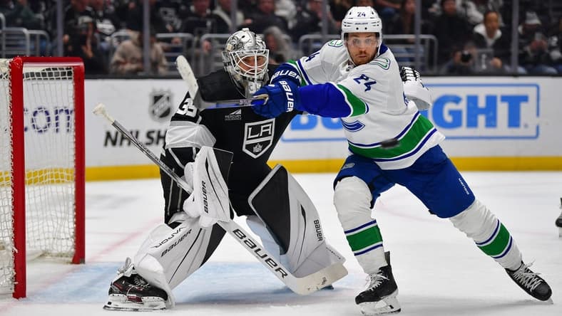 Mar 5, 2024; Los Angeles, California, USA; Vancouver Canucks center Pius Suter (24) moves in for the puck against Los Angeles Kings goaltender Cam Talbot (39) during the third period at Crypto.com Arena. Mandatory Credit: Gary A. Vasquez-USA TODAY Sports