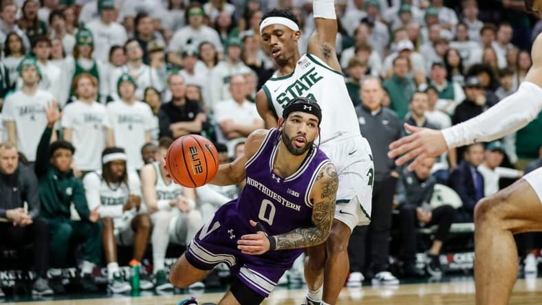 Michigan State guard Tyson Walker (2) defends Northwestern guard Boo Buie (0) during the first half at Breslin Center in East Lansing on Wednesday, March 6, 2024.