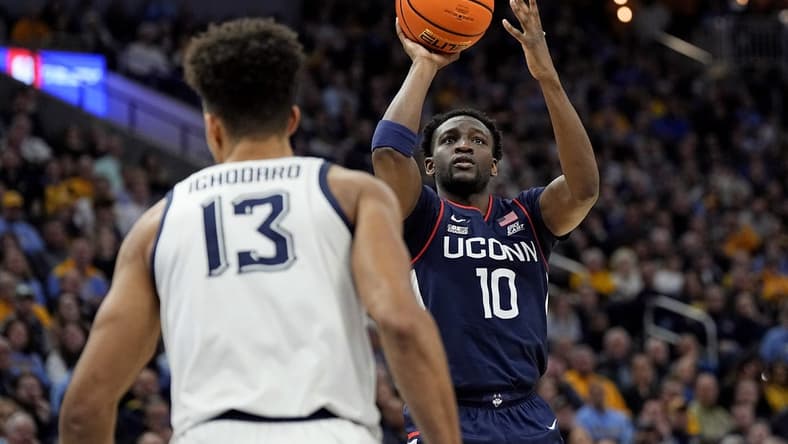 Mar 6, 2024; Milwaukee, Wisconsin, USA;  Connecticut Huskies guard Hassan Diarra (10) shoots during the first half against the Marquette Golden Eagles at Fiserv Forum. Mandatory Credit: Jeff Hanisch-USA TODAY Sports