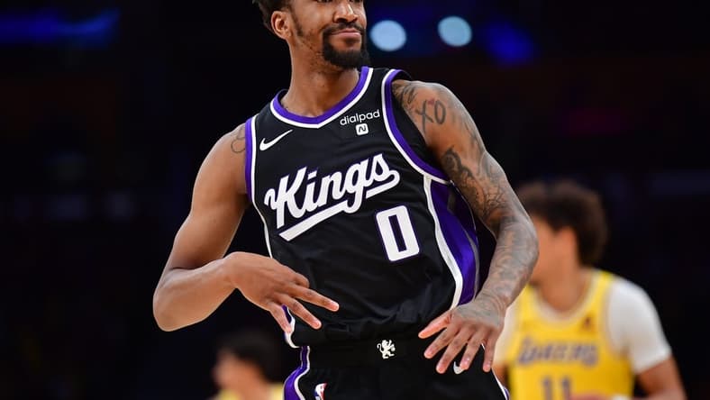 Mar 6, 2024; Los Angeles, California, USA; Sacramento Kings guard Malik Monk (0) reacts after scoring a three point basket against the against the Los Angeles Lakers during the second half at Crypto.com Arena. Mandatory Credit: Gary A. Vasquez-USA TODAY Sports