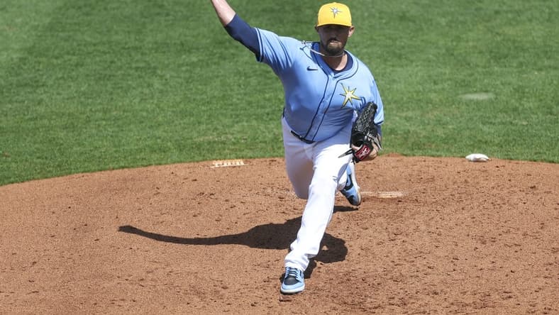 Mar 7, 2024; Port Charlotte, Florida, USA;  Tampa Bay Rays relief pitcher Shawn Armstrong (64) throws a pitch against the Philadelphia Phillies in the third inning at Charlotte Sports Park. Mandatory Credit: Nathan Ray Seebeck-USA TODAY Sports