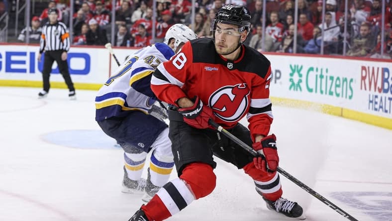 Mar 7, 2024; Newark, New Jersey, USA; New Jersey Devils right wing Timo Meier (28) looks back during the third period in front of St. Louis Blues defenseman Torey Krug (47) at Prudential Center. Mandatory Credit: Vincent Carchietta-USA TODAY Sports