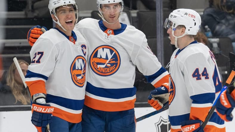 Mar 7, 2024; San Jose, California, USA; New York Islanders left wing Anders Lee (27) , left wing Pierre Engvall (18) and center Jean-Gabriel Pageau (44) celebrate during the third period against the San Jose Sharks at SAP Center at San Jose. Mandatory Credit: Stan Szeto-USA TODAY Sports