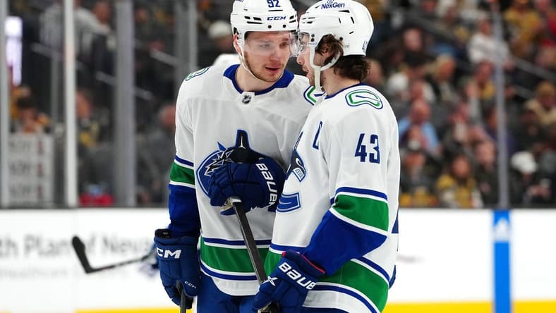 Mar 7, 2024; Las Vegas, Nevada, USA; Vancouver Canucks right wing Vasily Podkolzin (92) talks with Vancouver Canucks defenseman Quinn Hughes (43) before a face off against the Vegas Golden Knights during the first period at T-Mobile Arena. Mandatory Credit: Stephen R. Sylvanie-USA TODAY Sports