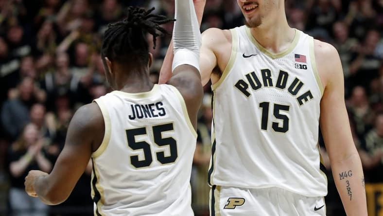 Purdue Boilermakers center Zach Edey (15) and Purdue Boilermakers guard Lance Jones (55) celebrate against the Rutgers Scarlet Knights, Thursday, Feb. 22, 2024, at Mackey Arena in West Lafayette, Ind. Purdue Boilermakers won 96-68.