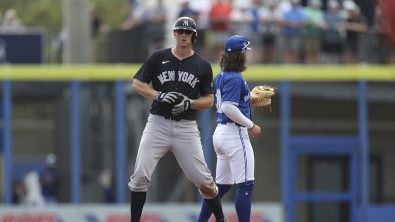 Mar 8, 2024; Dunedin, Florida, USA; New York Yankees third baseman DJ LeMahieu (26) hits an rbi double against the Toronto Blue Jays in the third inning at TD Ballpark. Mandatory Credit: Nathan Ray Seebeck-USA TODAY Sports