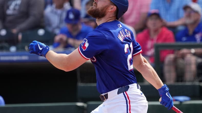 Mar 8, 2024; Surprise, Arizona, USA; Texas Rangers first baseman Jared Walsh (21) bats against the Kansas City Royals during the first inning at Surprise Stadium. Mandatory Credit: Joe Camporeale-USA TODAY Sports