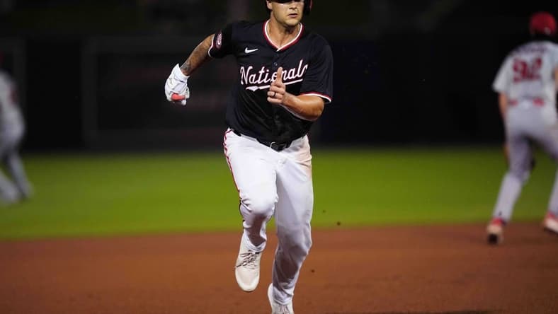 Mar 8, 2024; West Palm Beach, Florida, USA; Washington Nationals third baseman Nick Senzel (13) advances to third base on a base hit in the fourth inning against the St. Louis Cardinals at CACTI Park of the Palm Beaches. Mandatory Credit: Jim Rassol-USA TODAY Sports