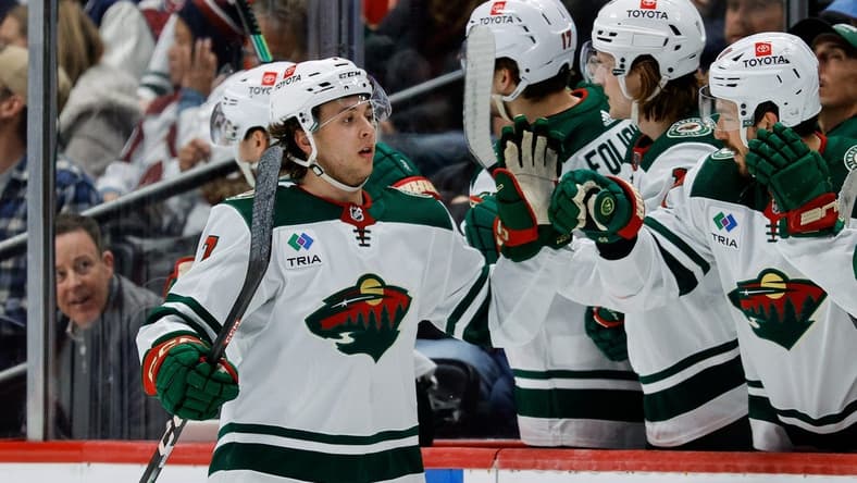 Mar 8, 2024; Denver, Colorado, USA; Minnesota Wild defenseman Brock Faber (7) celebrates with the bench after his goal in the second period against the Colorado Avalanche at Ball Arena. Mandatory Credit: Isaiah J. Downing-USA TODAY Sports