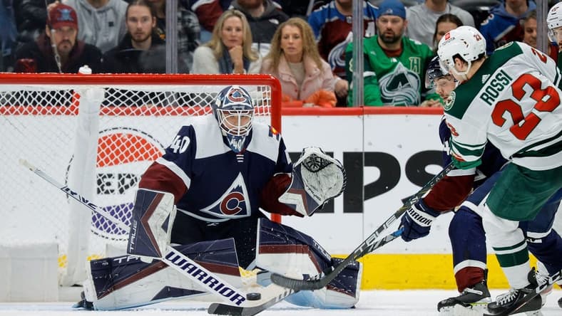 Mar 8, 2024; Denver, Colorado, USA; Minnesota Wild center Marco Rossi (23) attempts a shot against Colorado Avalanche goaltender Alexandar Georgiev (40) in the second period at Ball Arena. Mandatory Credit: Isaiah J. Downing-USA TODAY Sports