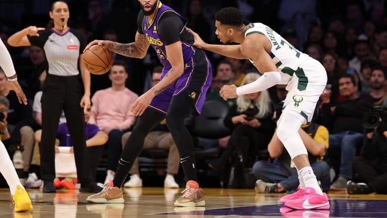 Mar 8, 2024; Los Angeles, California, USA; Los Angeles Lakers forward Anthony Davis (3) posts up against Milwaukee Bucks forward Giannis Antetokounmpo (34) during the first quarter at Crypto.com Arena. Mandatory Credit: Kiyoshi Mio-USA TODAY Sports
