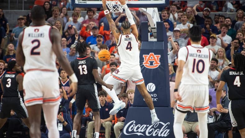 Auburn Tigers forward Johni Broome (4) dunks the ball as Auburn Tigers take on Georgia Bulldogs at Neville Arena in Auburn, Ala., on Saturday, March 9, 2024.
