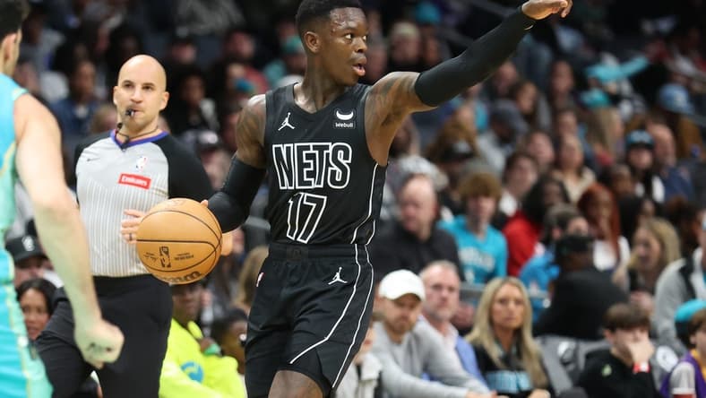 Mar 9, 2024; Charlotte, North Carolina, USA; Brooklyn Nets guard Dennis Schroder (17) directs the play against the Charlotte Hornets during the first quarter at Spectrum Center. Mandatory Credit: Cory Knowlton-USA TODAY Sports