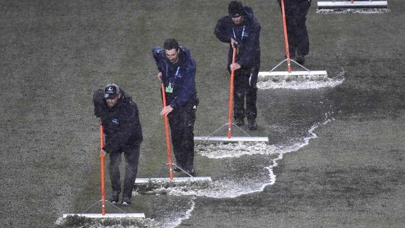 Mar 9, 2024; Philadelphia, Pennsylvania, USA; Members of the stadium grounds crew squeegee the field during a rain delay in the match between the Seattle Sounders FC and the Philadelphia Union at Subaru Park. Mandatory Credit: Eric Hartline-USA TODAY Sports