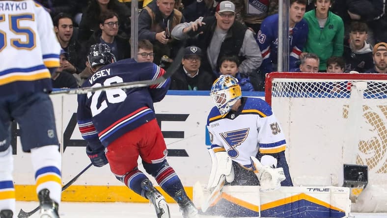 Mar 9, 2024; New York, New York, USA: New York Rangers left wing Jimmy Vesey (26) scores a goal on St. Louis Blues goalie Jordan Binnington (50) during the first period at Madison Square Garden. Mandatory Credit: Danny Wild-USA TODAY Sports