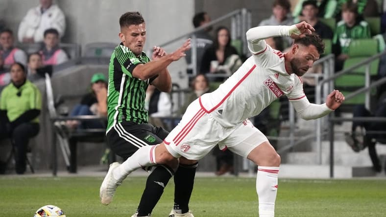 Mar 9, 2024; Austin, Texas, USA; Austin FC forward Diego Rubio (14) and St. Louis CITY SC midfielder Eduard Loewen (10) battle for the ball during the first half at Q2 Stadium. Mandatory Credit: Scott Wachter-USA TODAY Sports