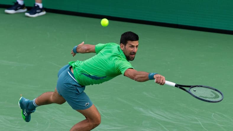 Novak Djokovic reaches for a shot during his match against Aleksandar Vukic at the BNP Paribas Open in Indian Wells Tennis Garden, California, on March 9, 2024.