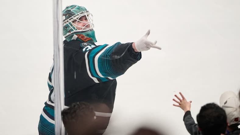 Mar 9, 2024; San Jose, California, USA; San Jose Sharks goaltender Magnus Chrona (30) tosses a puck to a fan after defeating the Ottawa Senators after the game at SAP Center at San Jose. Mandatory Credit: Robert Edwards-USA TODAY Sports