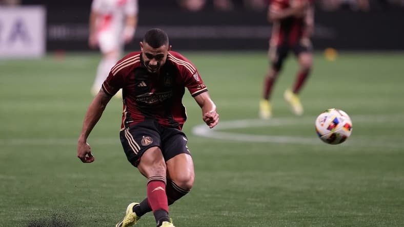 Mar 9, 2024; Atlanta, Georgia, USA; Atlanta United forward Giorgos Giakoumakis (7) shoots the ball against the New England Revolution during the second half at Mercedes-Benz Stadium. Mandatory Credit: Dale Zanine-USA TODAY Sports
