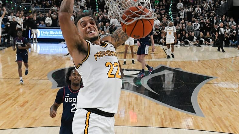 Mar 9, 2024; Providence, Rhode Island, USA; Providence Friars guard Devin Carter (22) dunks the ball against the Connecticut Huskies during the first half at Amica Mutual Pavilion. Mandatory Credit: Eric Canha-USA TODAY Sports