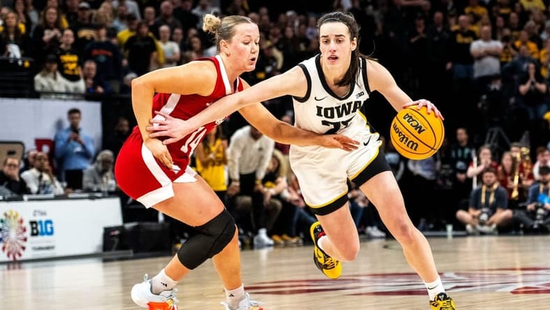 Iowa guard Caitlin Clark (22) drives to the basket against Nebraska guard Callin Hake during the Big Ten Tournament championship game at the Target Center on Sunday, March 10, 2024, in Minneapolis, Minn.