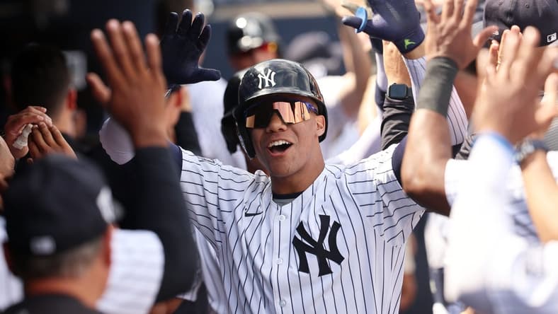Mar 10, 2024; Tampa, Florida, USA; New York Yankees left fielder Juan Soto (22) is congratulated after hitting a three run home run during the fourth inning against the Atlanta Braves at George M. Steinbrenner Field. Mandatory Credit: Kim Klement Neitzel-USA TODAY Sports