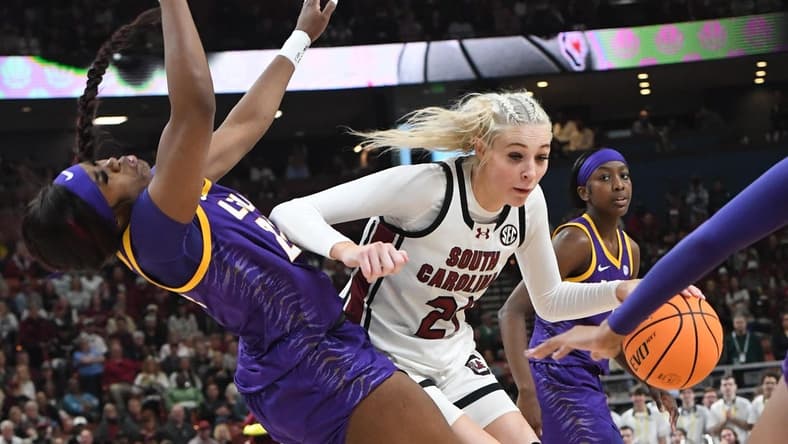 South Carolina guard Chloe Kitts (21) fouls Louisiana State University guard Aneesah Morrow (24) during the second quarter of the SEC Women's Basketball Tournament Championship game at the Bon Secours Wellness Arena in Greenville, S.C. Sunday, March 10, 2024.