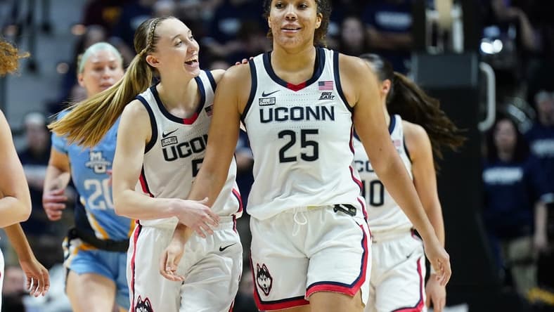 Mar 10, 2024; Uncasville, CT, USA; UConn Huskies guard Paige Bueckers (5) reacts with forward Ice Brady (25) after a play against the Marquette Golden Eagles in the second half at Mohegan Sun Arena. Mandatory Credit: David Butler II-USA TODAY Sports