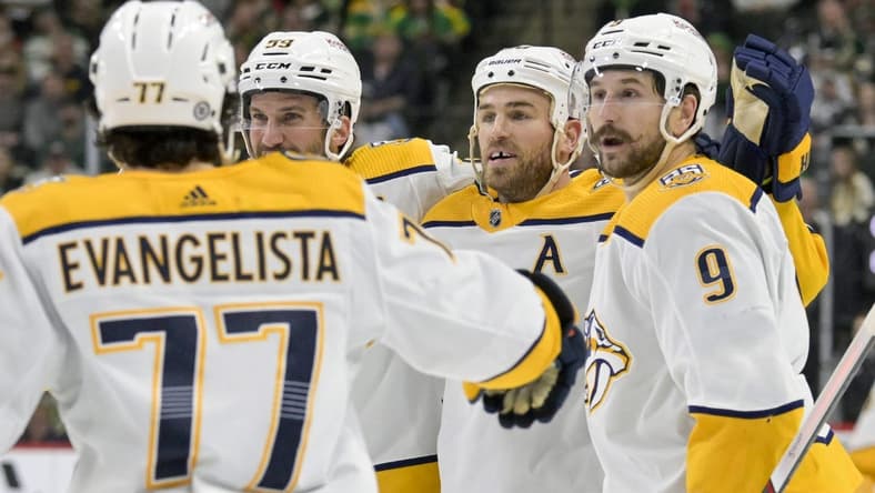 Mar 10, 2024; Saint Paul, Minnesota, USA;  Nashville Predators forward Ryan O'Reilly (90) celebrates his power play goal with defenseman Roman Josi (59) and forward Filip Forsberg (9) during the third period at Xcel Energy Center. Mandatory Credit: Nick Wosika-USA TODAY Sports