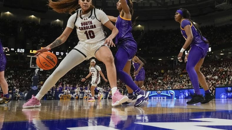 South Carolina Gamecocks center Kamilla Cardoso (10) works the ball toward the basket against LSU Lady Tigers forward Angel Reese (10) during the second half at Bon Secours Wellness Arena. Mandatory Credit: Jim Dedmon-USA TODAY Sports