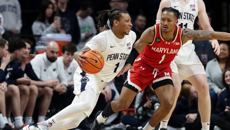 Mar 10, 2024; University Park, Pennsylvania, USA; Penn State Nittany Lions guard Ace Baldwin Jr (1) dribbles the ball toward the basket as Maryland Terrapins guard Jahmir Young (1) defends during the second half at Bryce Jordan Center. Penn State defeated Maryland 85-69. Mandatory Credit: Matthew O'Haren-USA TODAY Sports