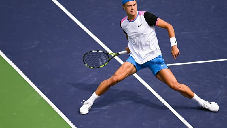 Mar 11, 2024; Indian Wells, CA, USA; Holger Rune (DEN) hits a shot in his third round match against Lorenzo Musetti (ITA) during the BNP Paribas Open at Indian Wells Tennis Garden. Mandatory Credit: Jonathan Hui-USA TODAY Sports