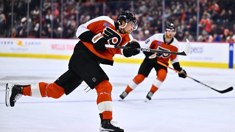 Mar 12, 2024; Philadelphia, Pennsylvania, USA; Philadelphia Flyers defenseman Travis Sanheim (6) shoots against the San Jose Sharks in the first period at Wells Fargo Center. Mandatory Credit: Kyle Ross-USA TODAY Sports