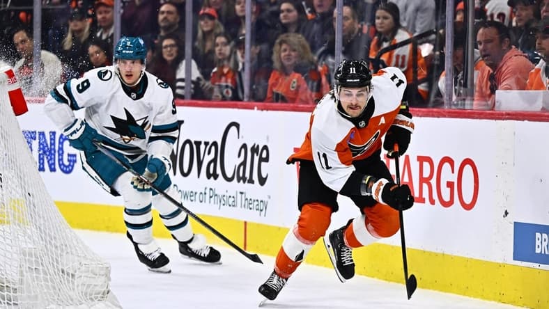 Mar 12, 2024; Philadelphia, Pennsylvania, USA; Philadelphia Flyers right wing Travis Konecny (11) reaches for the puck against the San Jose Sharks in the first period at Wells Fargo Center. Mandatory Credit: Kyle Ross-USA TODAY Sports