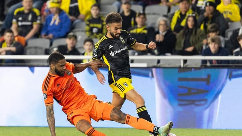 Mar 12, 2024; Columbus, OH, USA; Columbus Crew forward Diego Rossi (10) dribbles the ball while Houston Dynamo defender Micael (31) defends in the second half at Lower.Com Field. Mandatory Credit: Trevor Ruszkowski-USA TODAY Sports