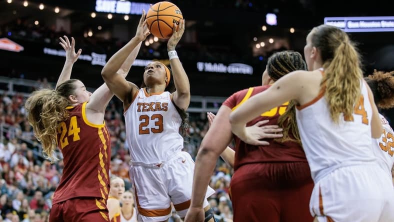 Mar 12, 2024; Kansas City, MO, USA; Texas Longhorns forward Aaliyah Moore (23) shoots the ball over Iowa State Cyclones forward Addy Brown (24) during the first half at T-Mobile Center. Mandatory Credit: William Purnell-USA TODAY Sports